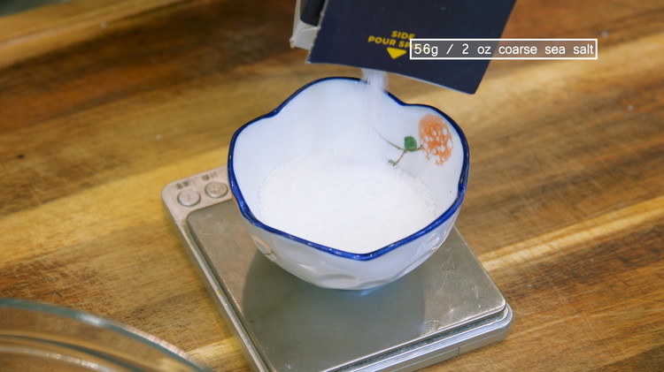 Image of Weigh and measure the salt, which should be 7% of the weigh of the vegetable. In my case, it is 56g / 2 oz.