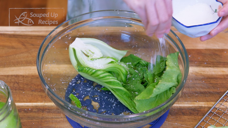 Image of Rub the mustard green with coarse sea salt for 10 minutes. Make sure you use a big container with deep walls so you can do lots of kneading and rubbing without spilling everywhere. Also, open up the leaves so you...