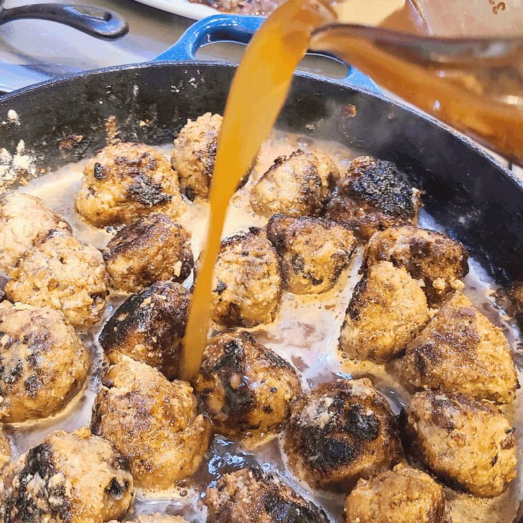 Image of Add the beef broth, remaining reserved onions, mustard, and Worcestershire. Stir well, and let simmer until the sauce has thickened and become slightly darker in color, about 10 minutes.