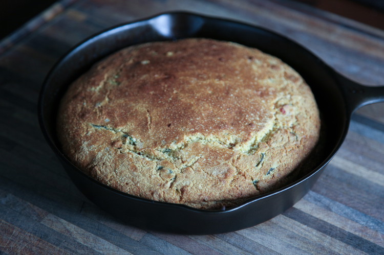 Image of Carefully, using mitts or towels to protect your hands, place that hot, batter-filled cast iron in the oven and bake for 45 minutes.