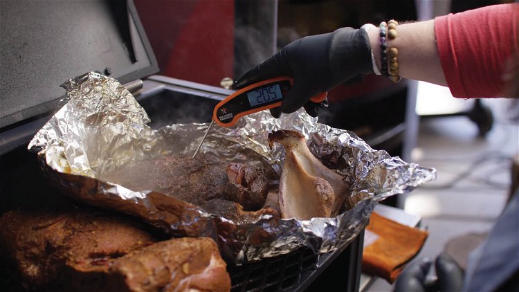 Image of Remove the pork butt from the grill when the blade...