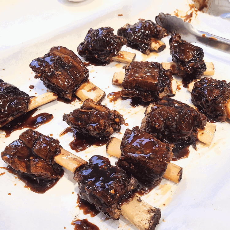 Image of Turn the broiler on in your oven and place the beef short ribs on a foil or parchment-lined baking sheet. Brush the sauce generously on all sides of the ribs and then broil for 1 to 2 minutes on each...