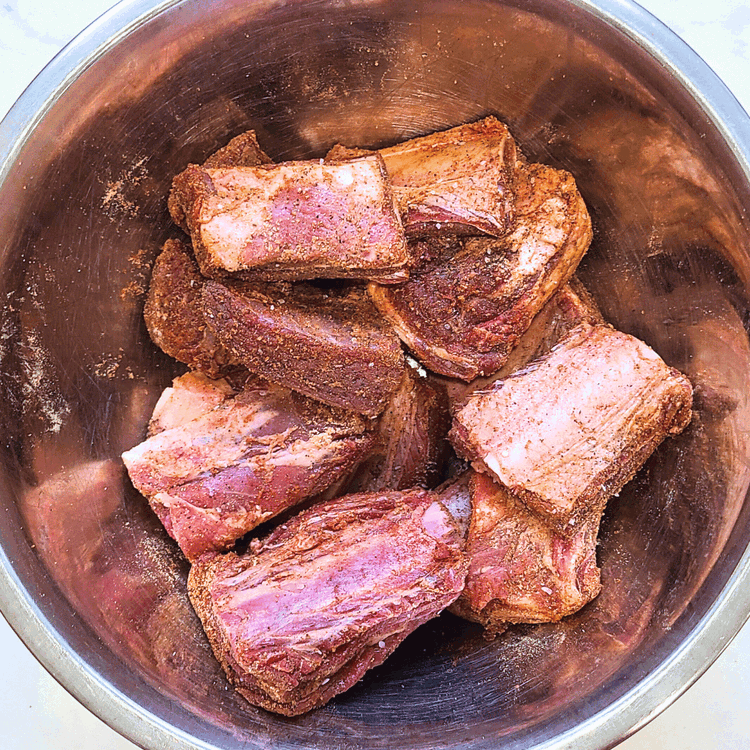 Image of Combine all dry rub spices and rub this mixture all over the ribs. You can do this part a few hours in advance and let the ribs sit in the fridge.