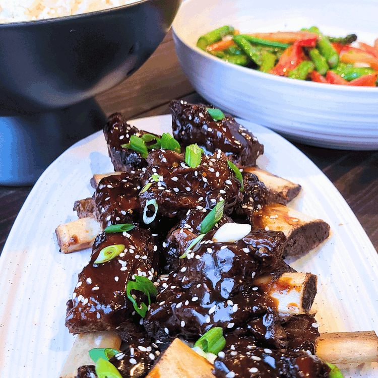 Image of These ribs pair well with white rice and garlic and ginger sauteed veggies.