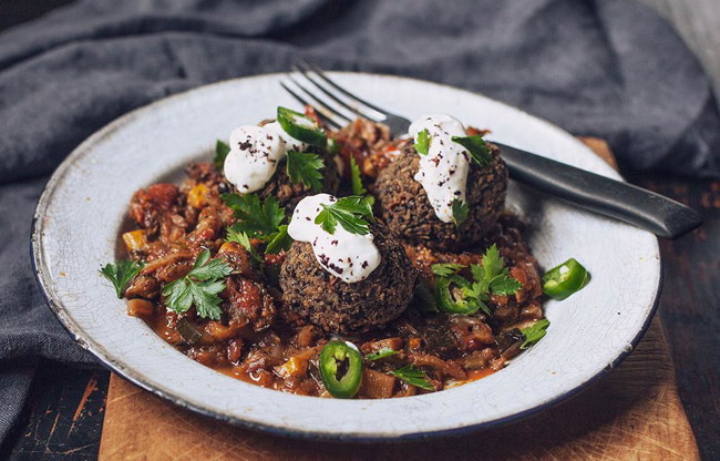 Image of beluga black lentil balls with veggie ragu