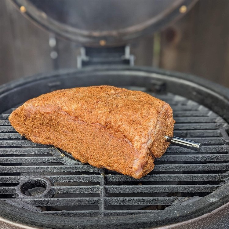 Image of Preheat your smoker to 250° using a wood such as...