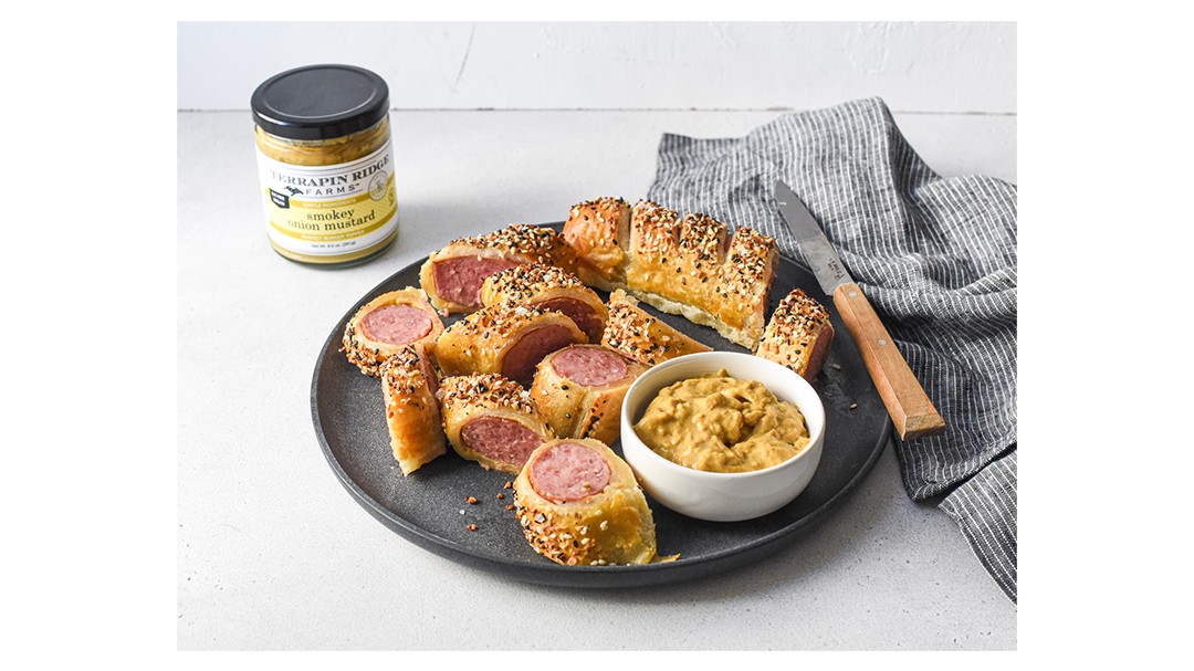 Image of Kielbasa Pigs in a Blanket with Smokey Onion Mustard