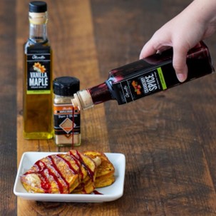 PUMPKIN PANCAKES WITH SPICED BUTTER & CRANBERRY DRIZZLE