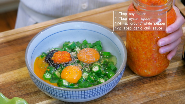 Image of Place the okra into a bowl. Crack in 3 eggs and add 1 tbsp of soy sauce, 1 tbsp of oyster sauce, 1/4 tsp of ground white pepper, and 1/2 tbsp of your favorite chili sauce to give the dish...
