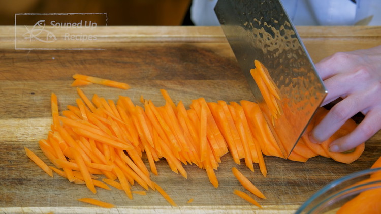Image of Peel the carrots, cut them into 1/8-inch thick slabs, then thinly julienne them.