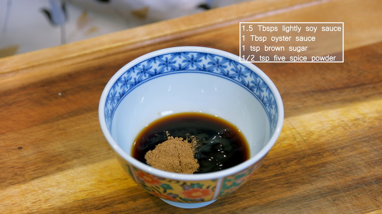 Image of Put together the following seasonings into a bowl: 1.5 tbsp of soy sauce, 1 tbsp of oyster sauce, 1 tsp of brown sugar, and 1/2 tsp of five spice powder. Mix well.