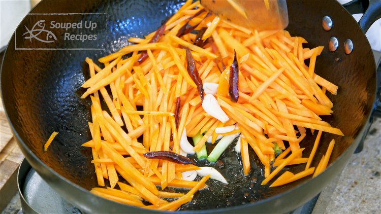 Image of Add the garlic, white part of the scallion, dried red...