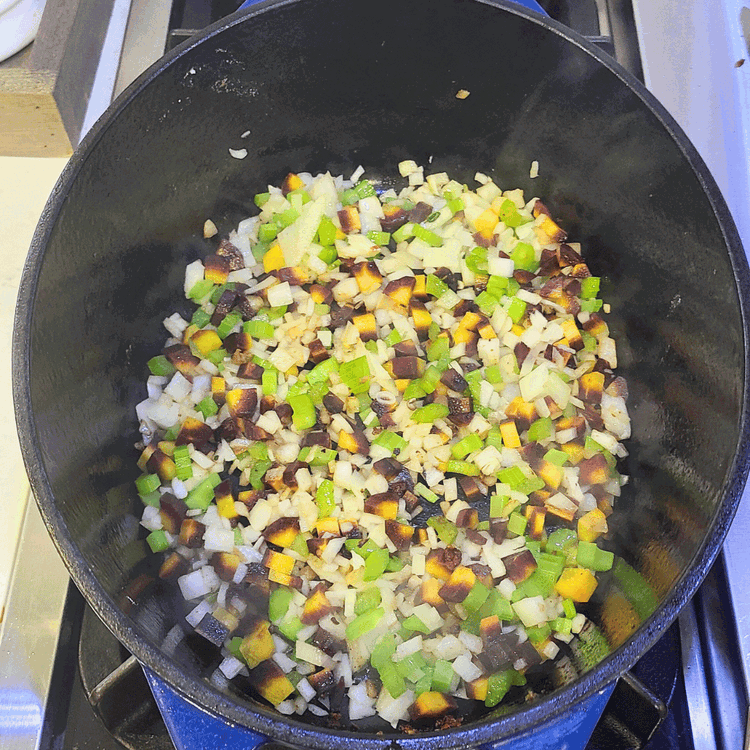 Image of Add the onions, carrots, and celery to the Dutch oven. Cook the onion mixture, stirring frequently, until the onions are translucent (about 5 minutes)  