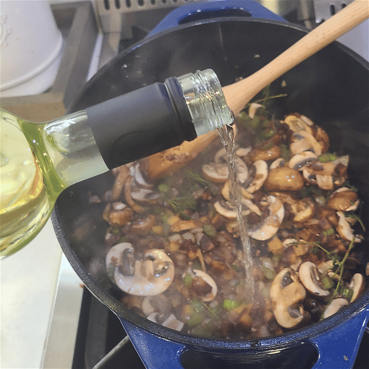 Image of Pour in the wine and deglaze the pot, be sure...