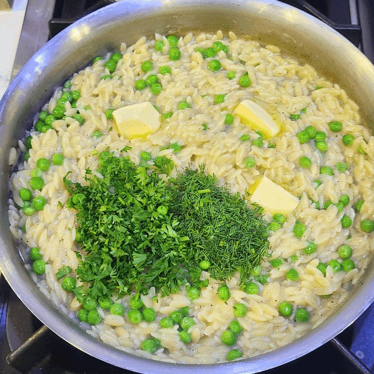 Image of Remove the pot from the heat and stir in the lemon juice, butter, and herbs