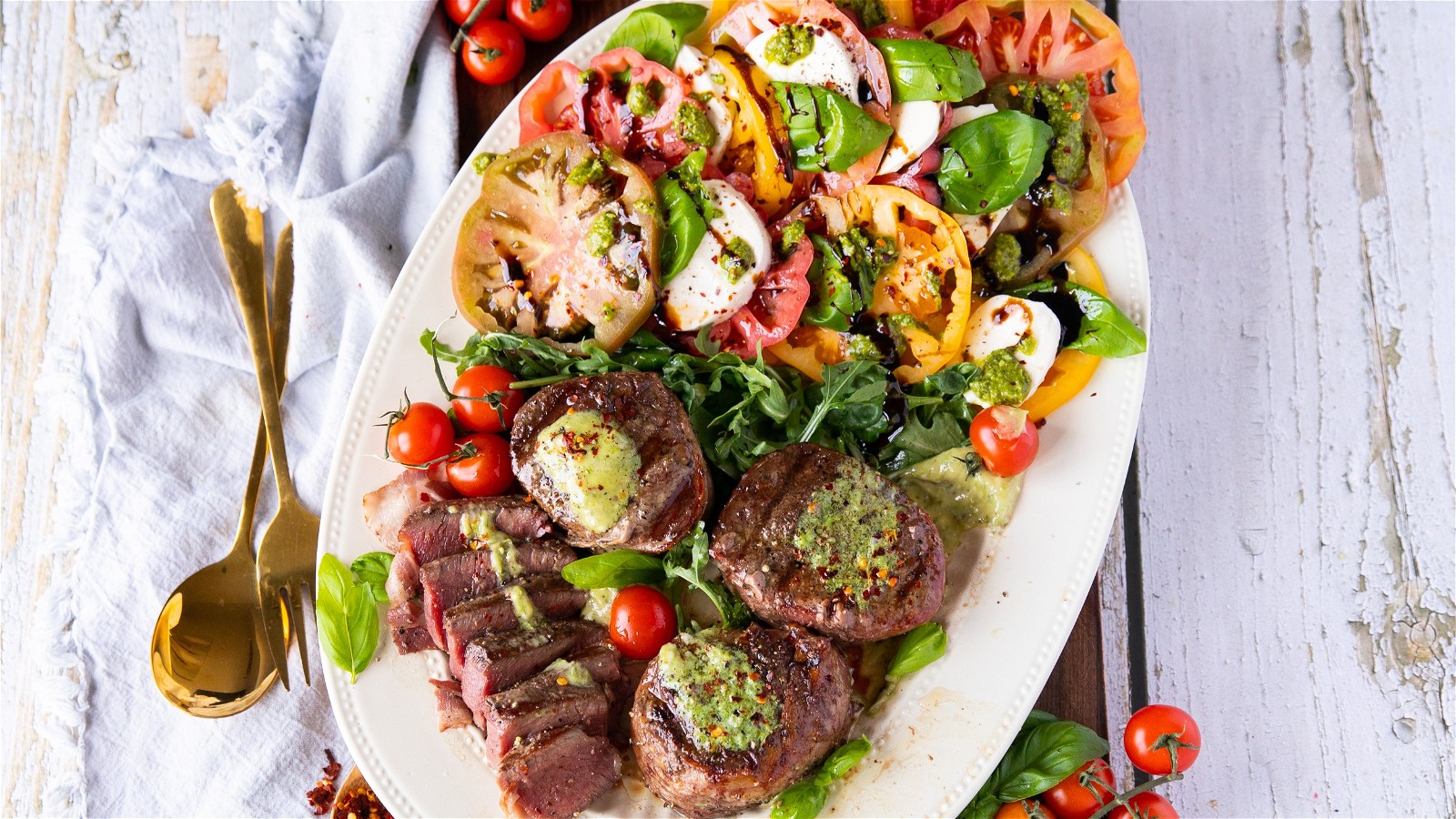 Image of Grilled Bacon Wrapped Tenderloin Steak With Caprese Salad