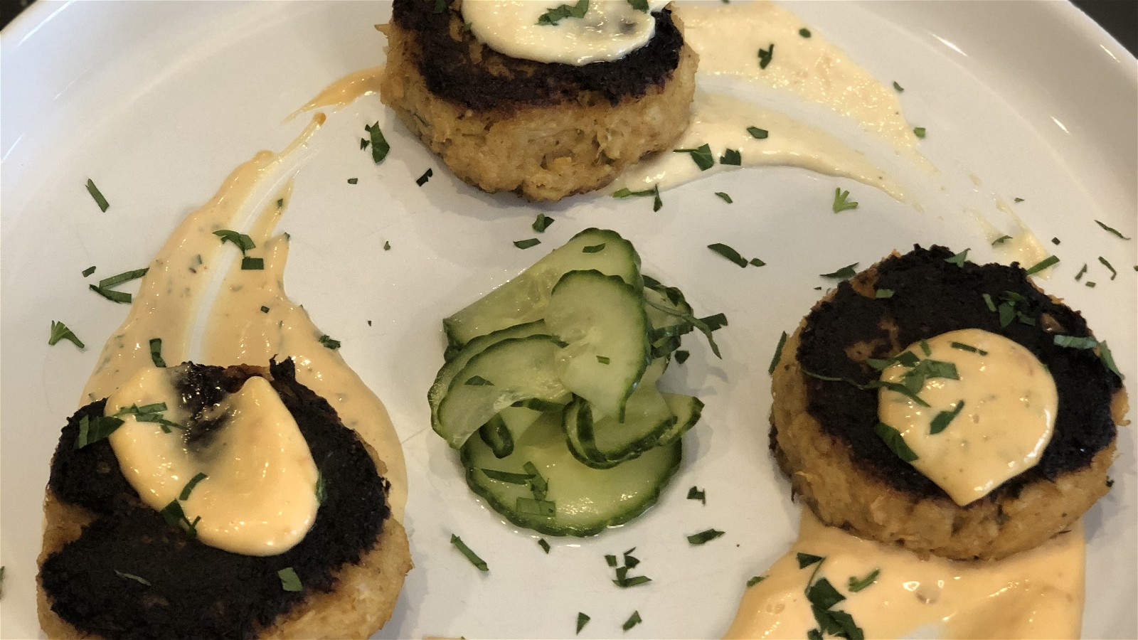 Image of Crab Cakes with Ginger Lime Cucumbers and Sriracha Aioli