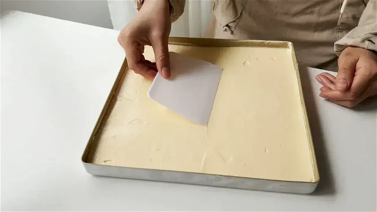 Image of Bake: Line the cake pan with a baking mat or...