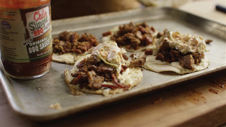 Image of To build the tacos, place the meatloaf on the tortillas...