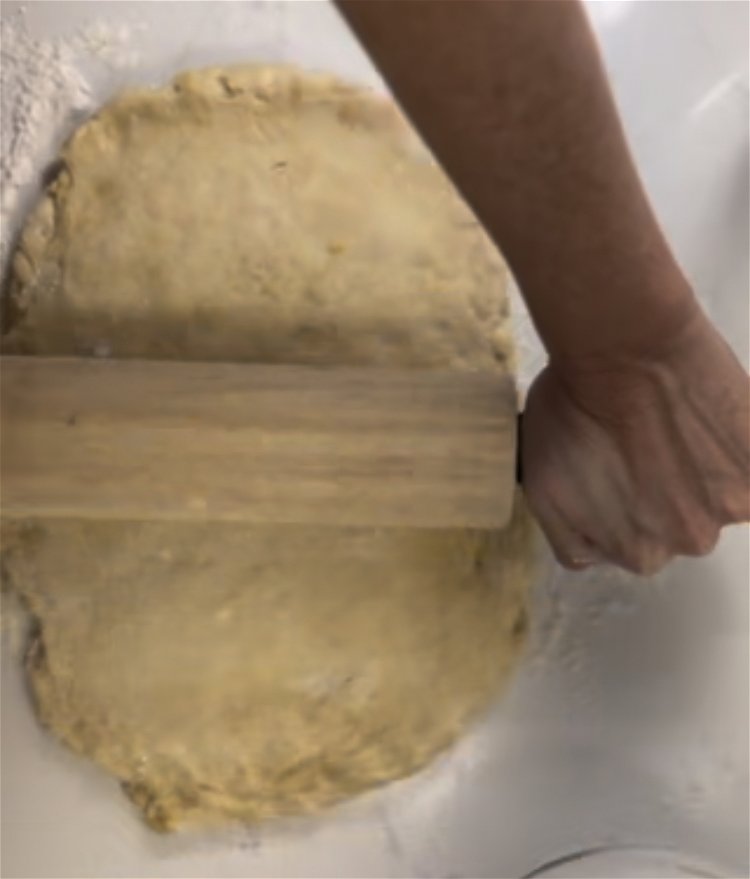 Image of Lightly flour countertop and turn dough out from bowl. Knead...
