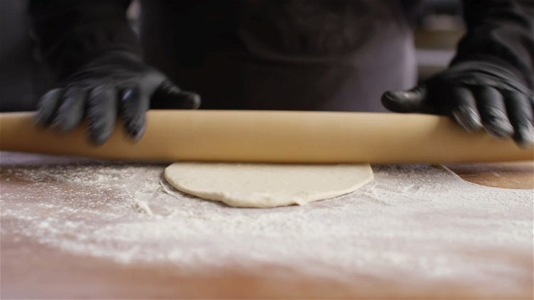 Image of Roll out your pizza dough until it’s about 6” in...