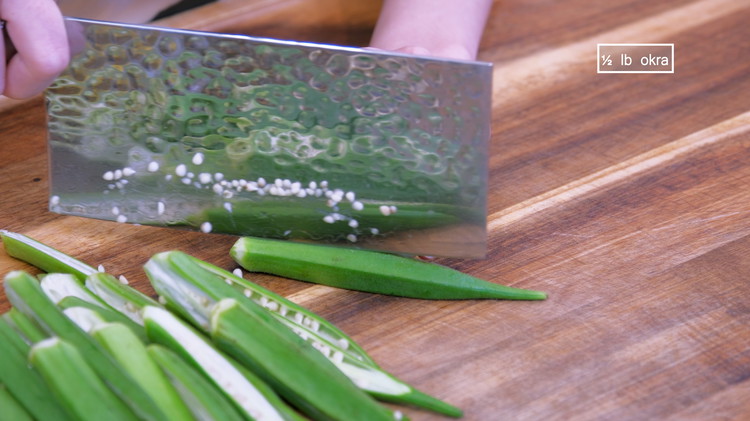 Image of Use a peeler to peel the tough calyx. Slice each pod in halves, lengthwise. 