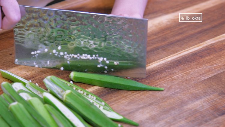 Image of Use a peeler to peel the tough calyx. Slice each...