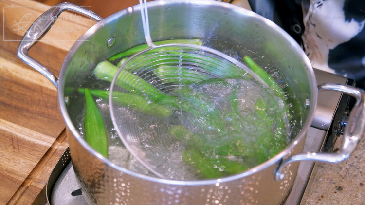 Image of Bring 2 liters of water to a boil. Add a drizzle of cooking oil and toss in the okra. The oil will coat the surface of the okra and retain its vivid green color. Blanch them for 1.5 minutes. The...