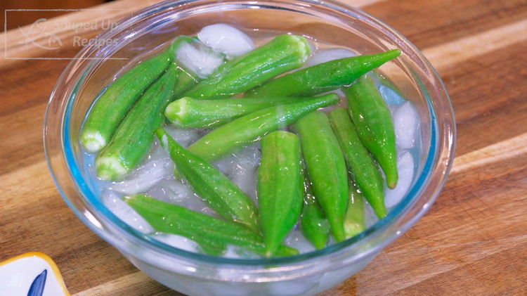 Image of Take the okra out and add them to an ice bath for a few minutes. This step is essential as it enhances the crispy texture.