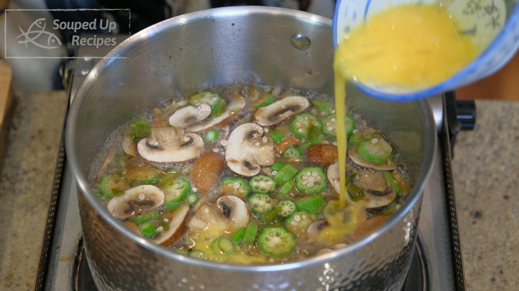 Image of Crack one egg into a bowl and whisk it well. Drizzle the into the soup. Give it a taste and add a pinch of salt or to taste. Mix well and turn off the heat.