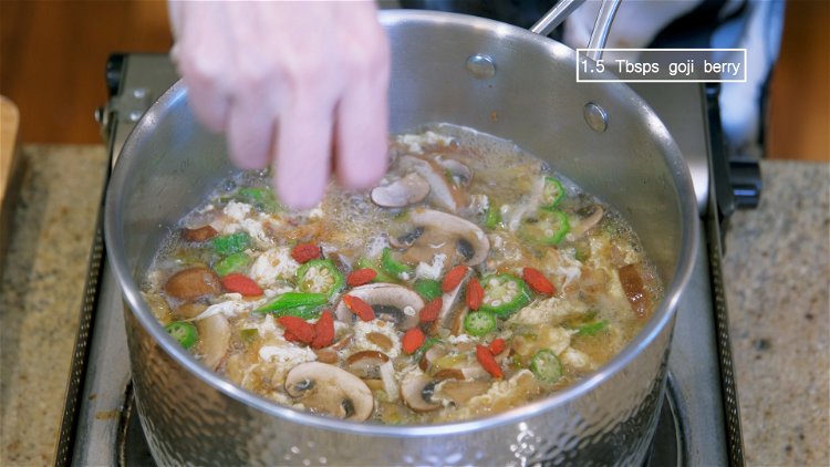 Image of Garnish the soup with some goji berry.