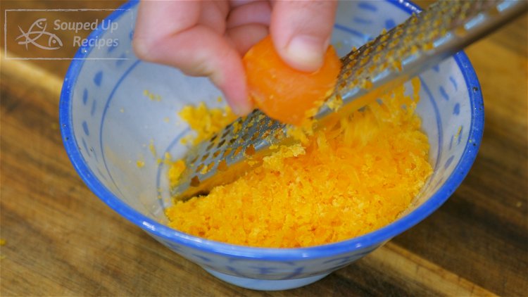 Image of Use a zester to shave the salted egg tolks finely...
