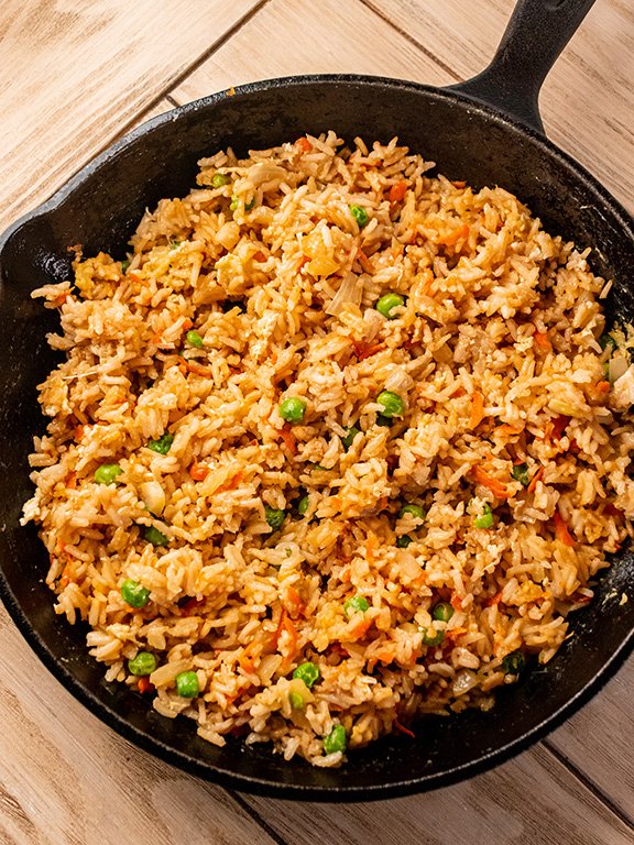 Image of Make Fried Rice: Heat butter in a large skillet over...