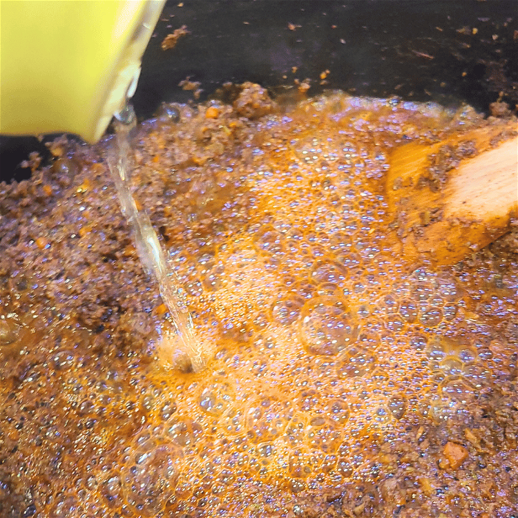 Image of Add the beer scraping the bottom and sides of the...