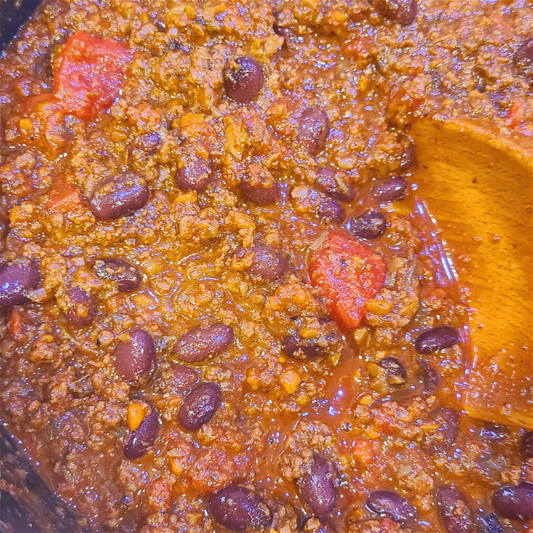 Image of Stir in the tomato paste, diced tomatoes with their juice,...