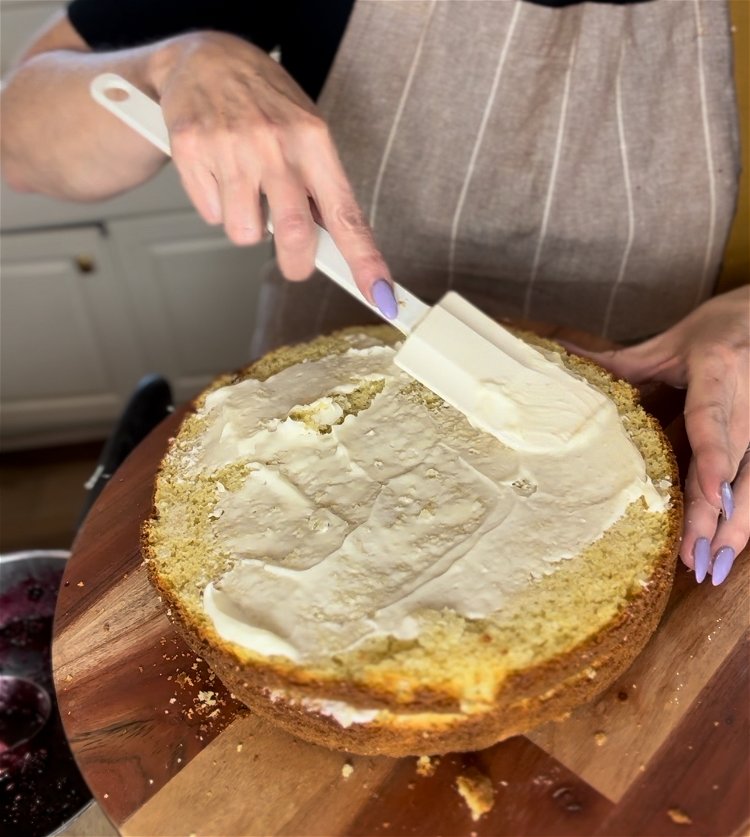 Image of Assemble the cake by using a serrated knife and carefully...