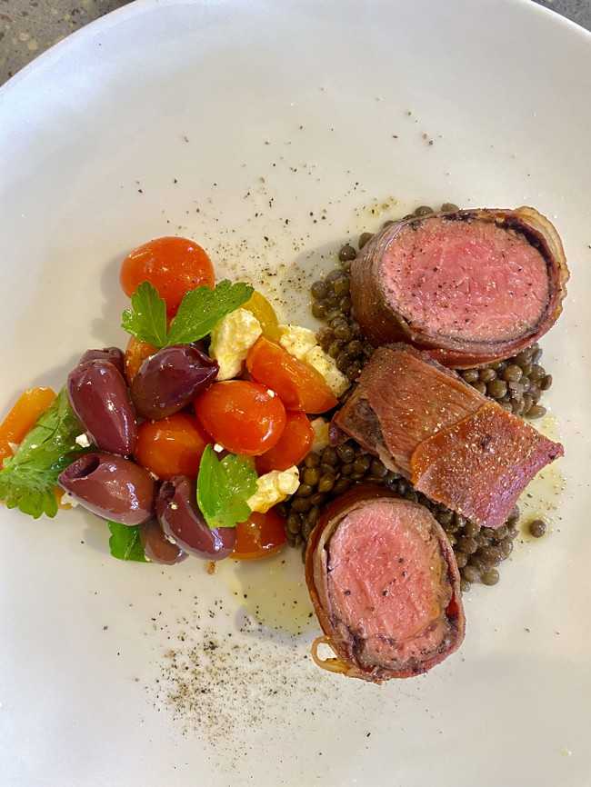 Image of tapenade-roasted lamb with lentils & olive salad