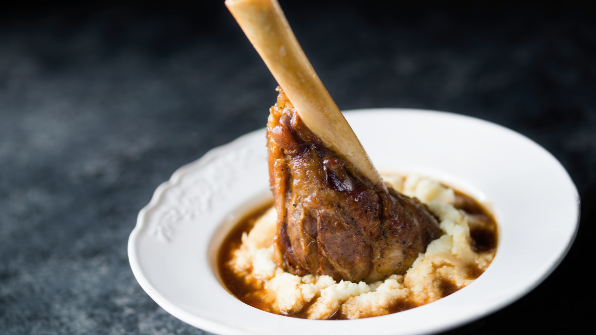 Image of Red Wine Braised Lamb Shank with Rosemary & Thyme served with Garlic Mashed Potatoes