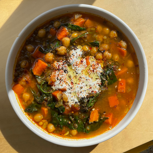 Image of spiced chickpea, carrot, lentil & spinach soup with dill yoghurt