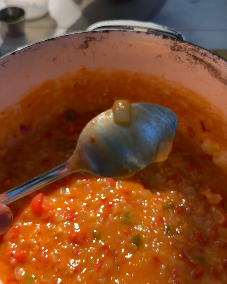 Image of Add the stock and bring to a boil, then simmer until the mixture is thick and sticks to a spoon — about 45 minutes