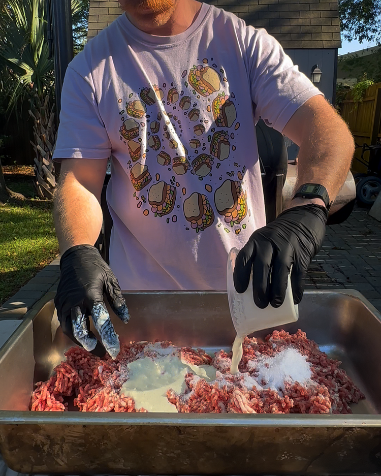 Image of Add all your sausage ingredients to the grind except for the etouffee. I like to mix my milk powder in the water before putting it in the grind to help it distribute and not clump. Mix until everything is incorporated,...