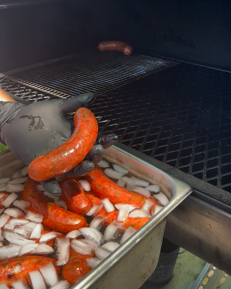 Image of Bump your smoker to 225 degrees F and bring your sausages to 160 degrees F internal and then drop them in an ice bath for 10 minutes