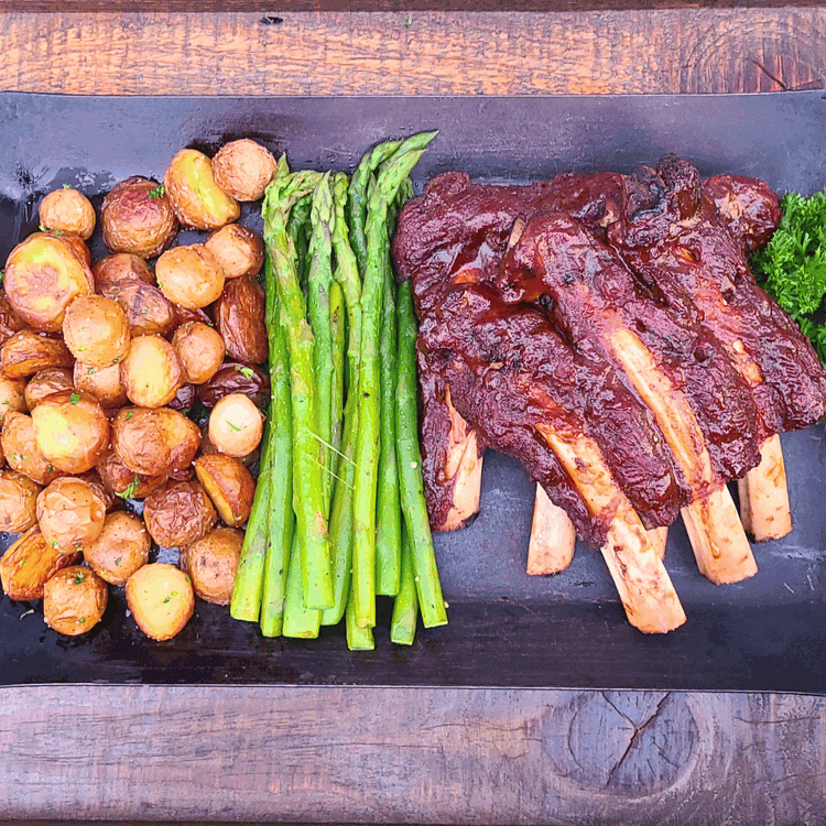 Image of Rest and Serve: Once done, remove the ribs from the smoker and let them rest for a few minutes before slicing. Serve with your favorite sides and enjoy!