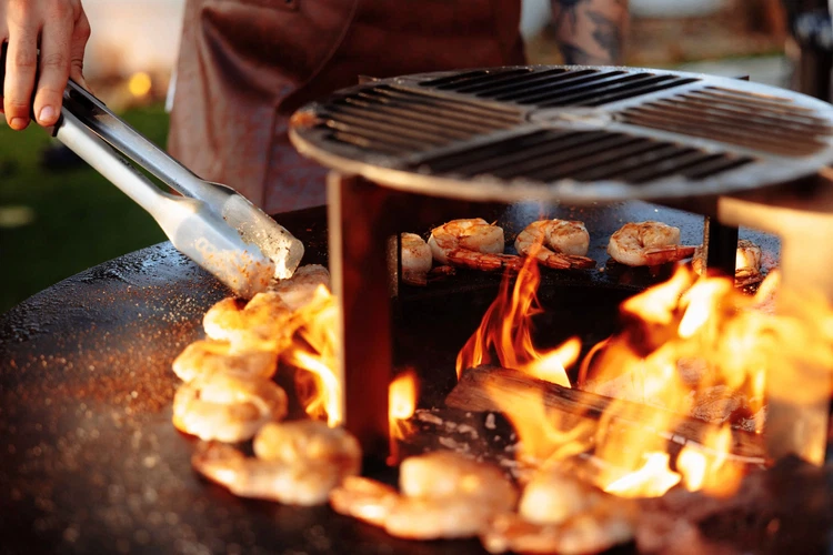 Image of Time to Grill: Preheat your Unifire™ Grill to a medium-high heat to prepare for grilling. Lightly oil the grill surface to prevent sticking. Place the seasoned gambas and mini scallops directly on the grill plate. Grill the gambas for about...