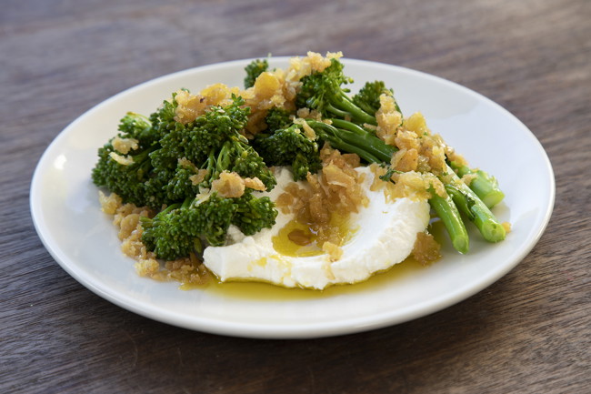 Image of roasted crushed faba beans with cumin, lime, broccolini & labne