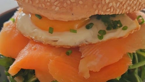 Picture of Salmon Bagel with fried egg, Smoke Gochujang and greens