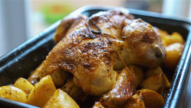 Image of Smokey Campfire Delight: Dutch Oven Roast Chicken and Root Veggies