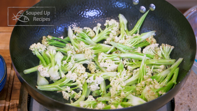 Image of Add the cauliflower to the wok and stir over medium heat for 3-4 minutes or until slightly charred. Take the cauliflower out and set it aside. The dish’s name Ganguo means dried pot, referring to this smoky and concentrated flavor,...