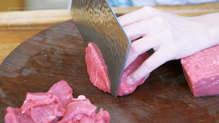 Image of Slice the beef into 1/8-inch slices. I am using top sirloin fillet, but beef chuck and flank steak also work.