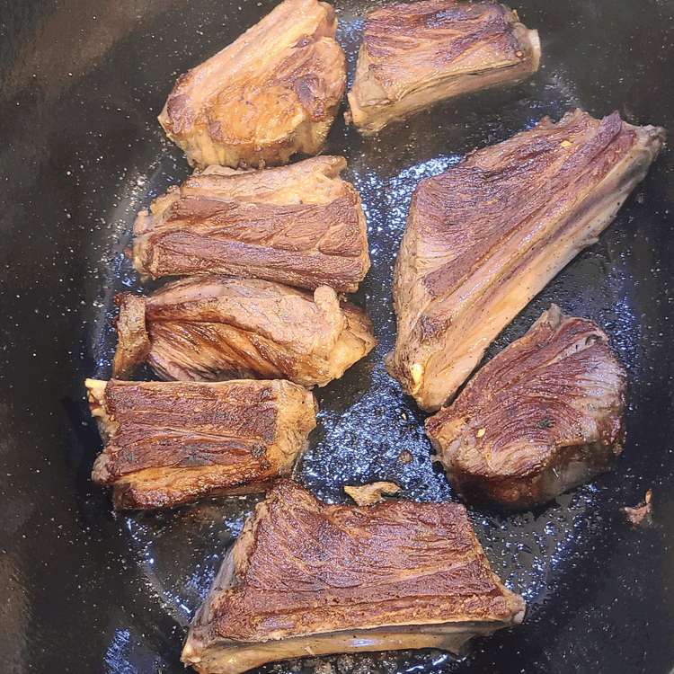 Image of In a heavy Dutch oven or similar pot, sear the short ribs over medium-high heat, starting with the fattiest side down. This will render fat for subsequent browning, but if your ribs are lean as can be the case with...